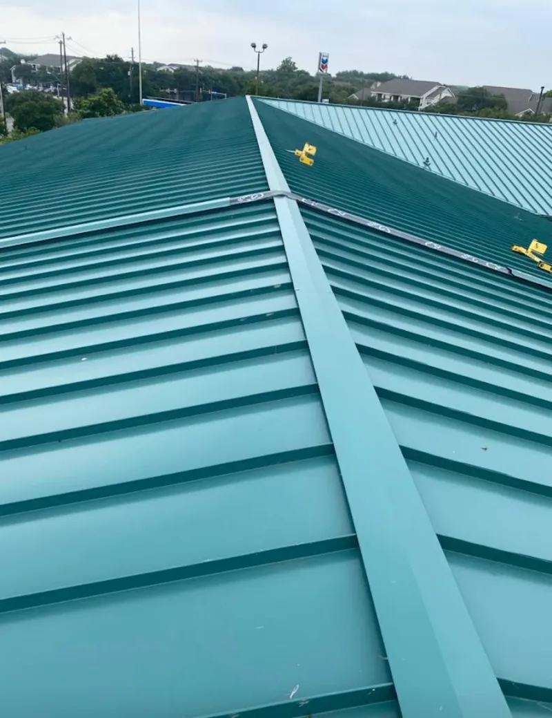 Green commercial metal roof ridge and valley for Metal Roof Repair in Winooski